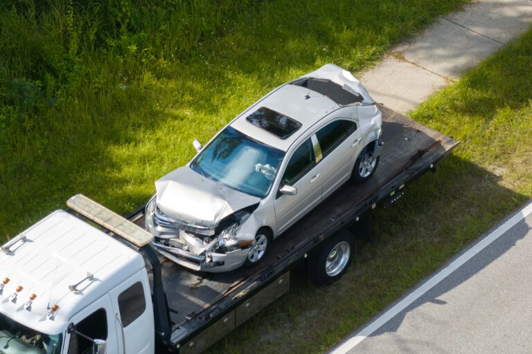 damaged-car-on-tow-truck-after-accident-2026-03-25-03-39-32-utc